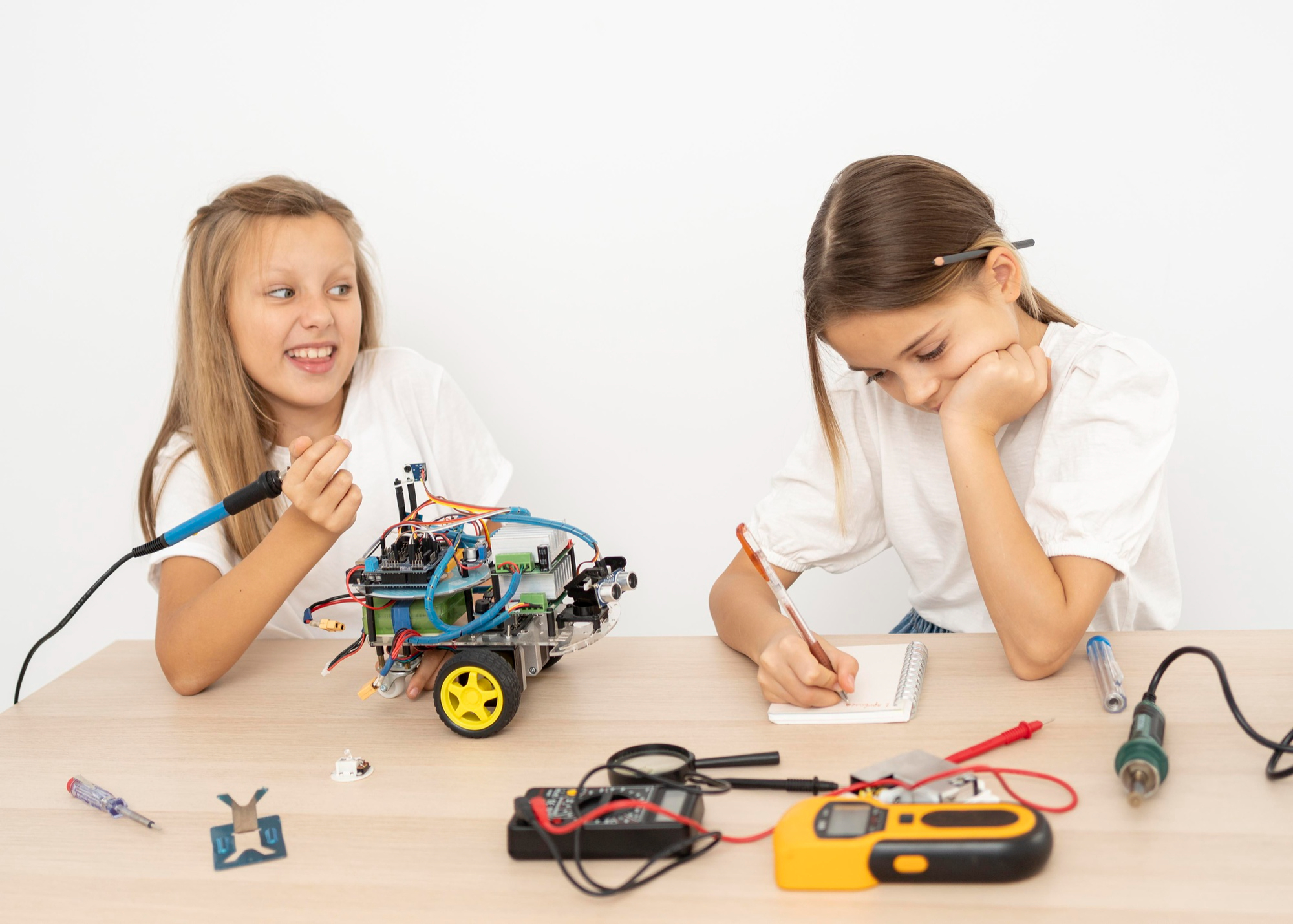 two-friends-doing-science-experiments-with-robotic-car-littleroboz